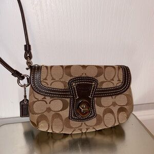Coach Signature Legacy Flap Wristlet. Tan brown with gold hardware.